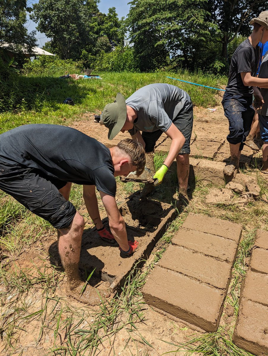 MrScullyCCC's tweet photo. Team 1 - making mud bricks for a local earth home.  Dirty work! @CartertonCC  #CCCThailand2023 https://t.co/1bnEhQEejr