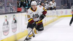 Tuukka Tieksola carries the puck during a game with the Chicago Wolves.