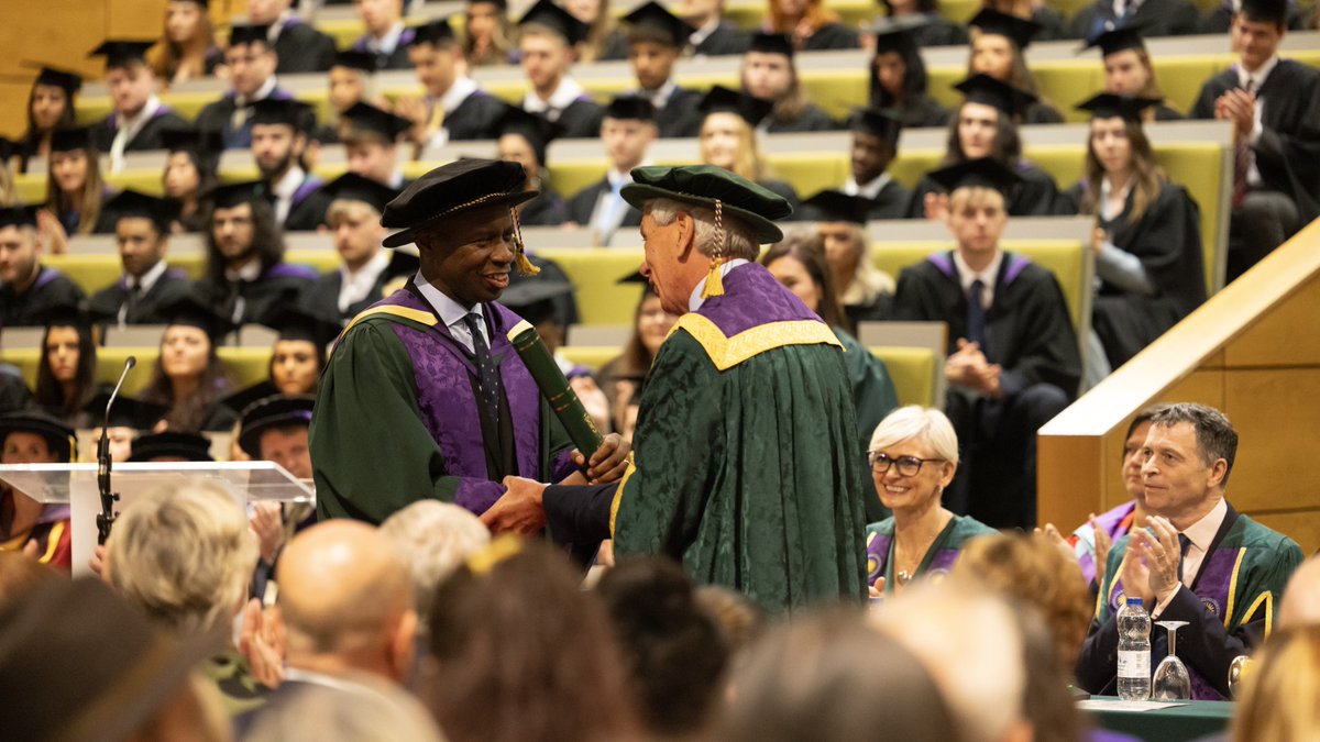Clive Myrie receives his Honorary Doctorate from Dr John Cater.