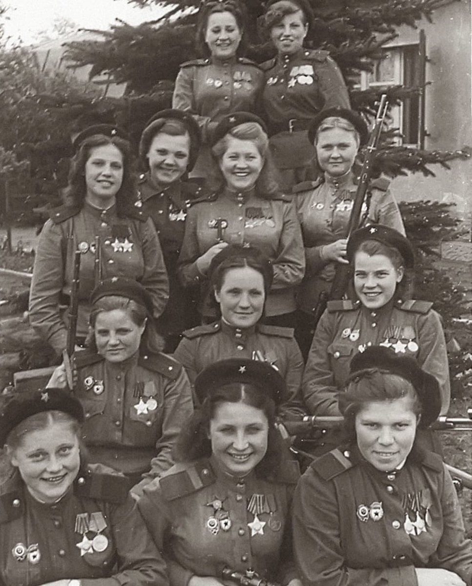 historyinmemes's tweet photo. 12 Soviet women, 775 confirmed kills in one picture. During World War 2, the Soviet government recruited some 7.75 million women, of whom 800,000 served in the military. This photo was taken in Germany, May 4, 1945.

The 3rd Shock Army, part of the 1st Belorussian Front, was home to remarkable female snipers during World War II. These 'Shock' armies were specially structured to engage and dismantle significant enemy forces, benefitting from increased armored and artillery assets compared to other combined arms armies. When needed, the Shock armies were further reinforced with mechanized, tank, and cavalry units.

One of the precision roles performed with exceptional expertise by many female soldiers was sniping. In 1943, it is estimated that there were over 2,000 female snipers in the Soviet armed forces, who collectively achieved an impressive tally of more than 12,000 confirmed kills.

Among the standout female snipers were Nina Alexeyevna Lobkovskaya and Ukrainian Lyudmila Pavlichenko, who garnered particular recognition for her extraordinary feat of eliminating over 300 enemy soldiers. The Soviet Union made extensive and effective use of women in sniping duties, recognizing that this role suited them well. Good snipers demonstrated patience, carefulness, and deliberation, skills that many women soldiers possessed. Additionally, snipers' ability to avoid hand-to-hand combat and their need for higher levels of aerobic conditioning made it a role that women could excel in.