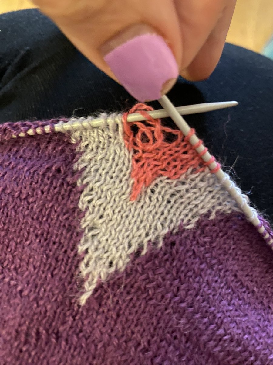 KnitWit78's tweet photo. Good grief #knittingtwitter. Obviously the more sensible than me know this, but don’t try and do fine lace intarsia right before bed after a long day. I don’t know what I did, or how I fixed it, or why there’s still a loop at the back. Don’t need tips - just understanding! https://t.co/BeYi9Mfsmn