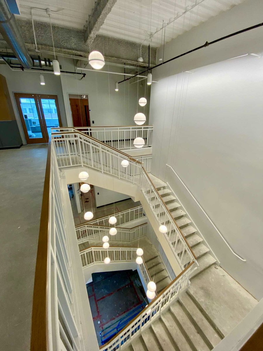 DesignByVenture's tweet photo. A favorite feature of our design, the grand stair light fixture, was recently installed in one of our commercial office projects. https://t.co/XiSgtfQU1o