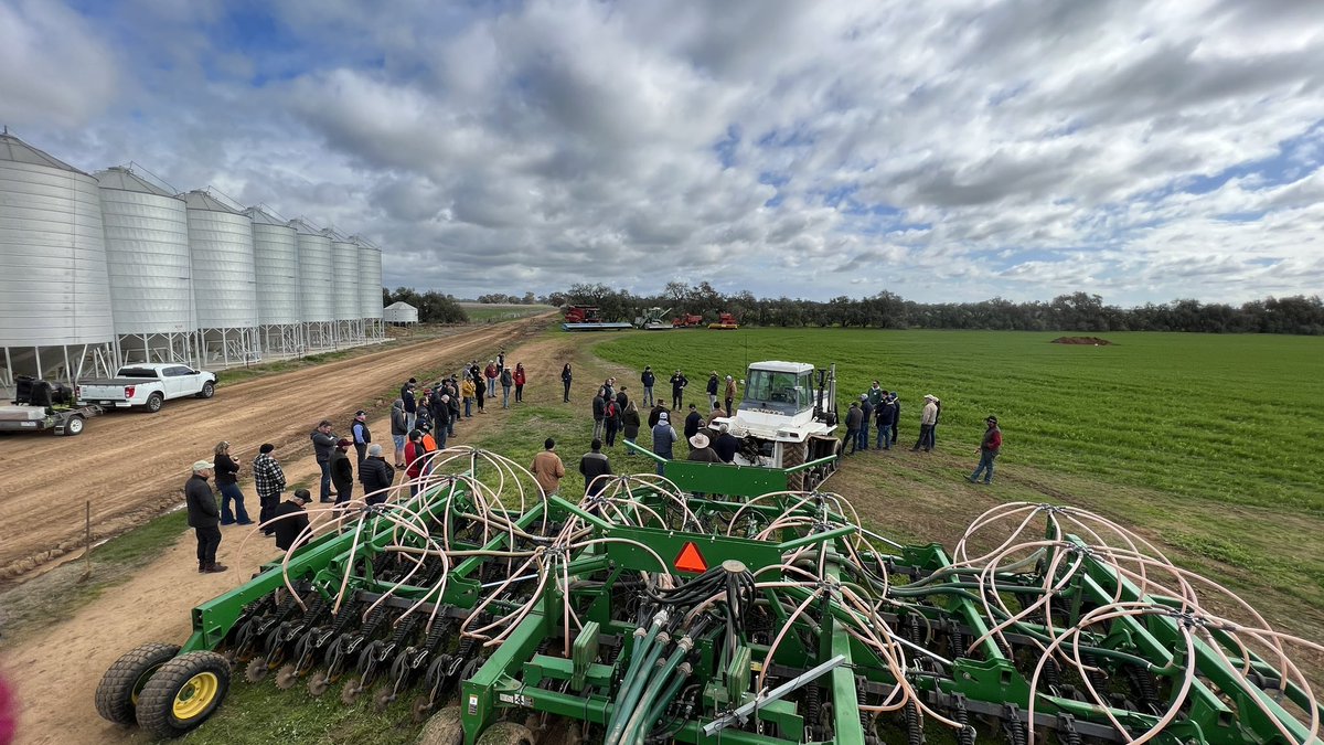 VicNotill's tweet photo. Aerial view of group of farmers from NSW, Vic, SA, NZ at VicNoTill conference field day at Rochester - 2 soil pits and a vintage machinery tour kick off Day 1 #vicnotilltransition23 https://t.co/kJrvuPVPpp