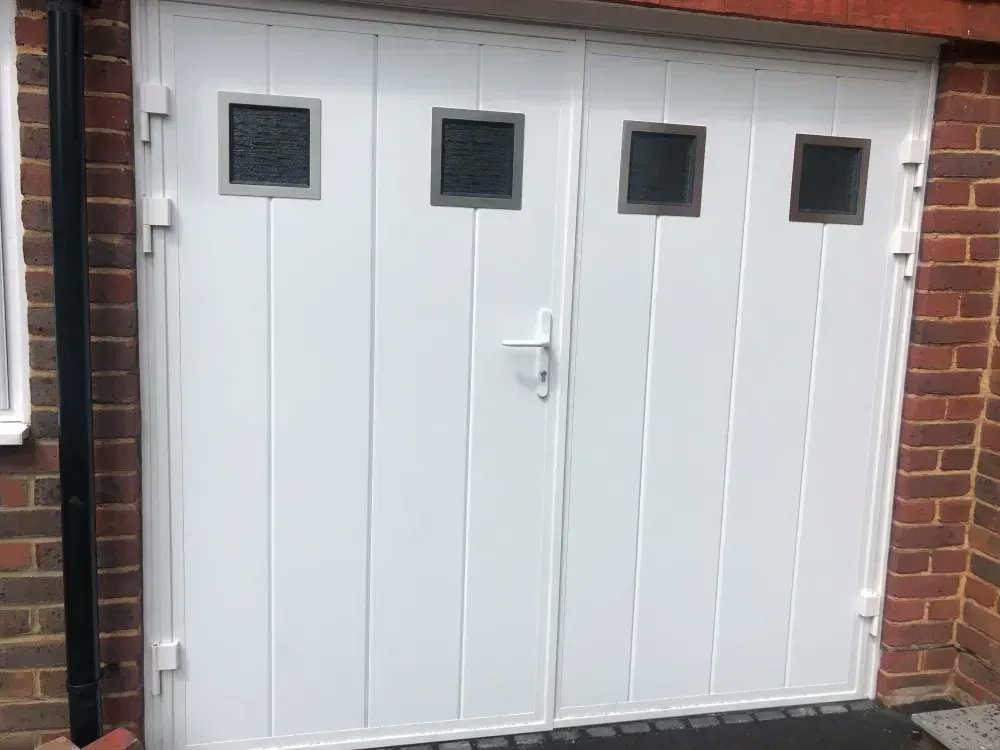 SEGARAGE's tweet photo. Our customer wanted quick access to his garage but wanted to cut out the cold drafts – this new @RyternaDoors side-opening garage door was the answer: https://t.co/ijD37W5R8W https://t.co/eG6He4bHjV