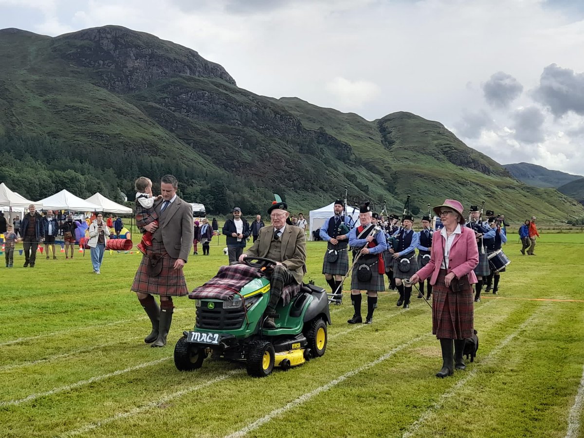 skyedrummajor's tweet photo. 90 yr young Games Chieftain leads Isle of Skye Pipeband on his garden @JohnDeere into @LochcarronGames 4 generations Macpherson family. https://t.co/T6cmQ8dcB7