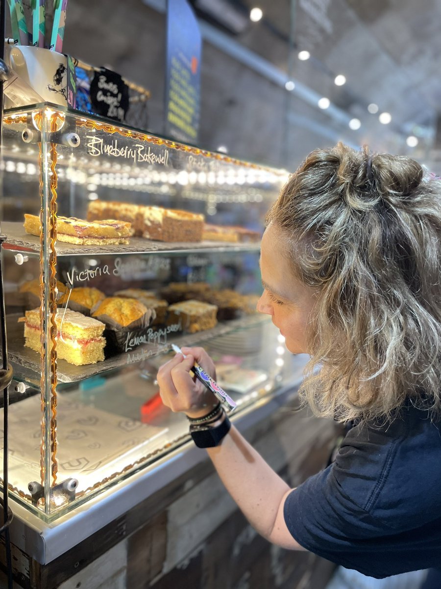 Tamsin is practicing her artistic skills on our glass cake cabinet 🧁
