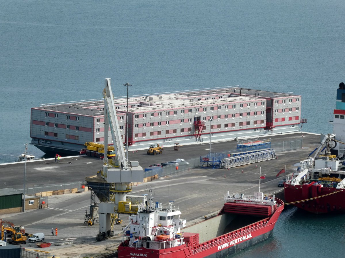 SeanThe1andOnly's tweet photo. The Bibby Stockholm has docked at Portland port. It's finally here. Checked in for 18 months at the docks let's see what happens. 

#bibbystockholm #barge #port #asylumseekers #workhasbegun #docks #uk #news #watchthisspace #portland #dorset https://t.co/zBgQD05kP7