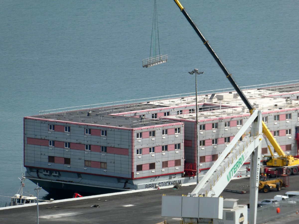 SeanThe1andOnly's tweet photo. The Bibby Stockholm has docked at Portland port. It's finally here. Checked in for 18 months at the docks let's see what happens. 

#bibbystockholm #barge #port #asylumseekers #workhasbegun #docks #uk #news #watchthisspace #portland #dorset https://t.co/zBgQD05kP7