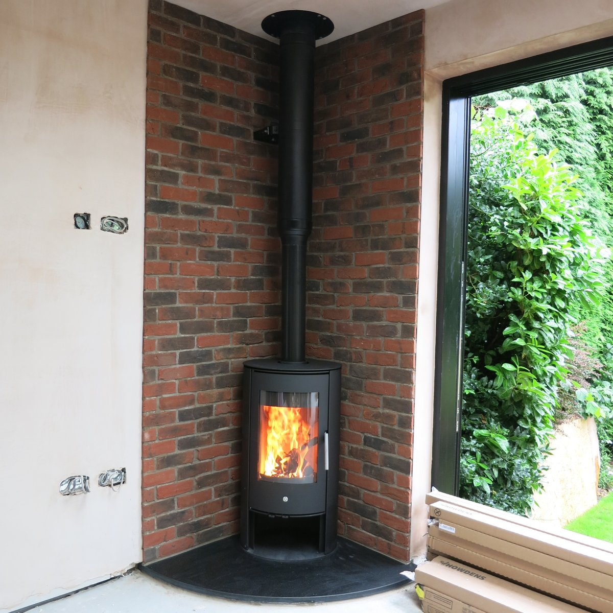 Another delighted #chorlton client with the installation of their @percydoughty <a href="/rapidcarrot77/">Cece Mulroy</a> Penman Olsberg Kassel 5kw wood burning stove with an <a href="/CheshireMarble/">Cheshire Marble</a> black honed granite corner hearth. How cool is that brickwork!!!! #manchester #theheatison #welldonePaul
