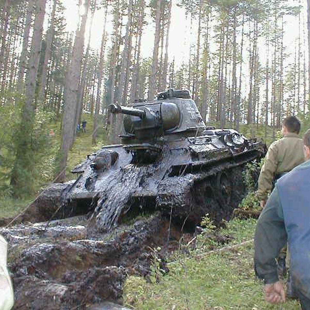 Past_Factory's tweet photo. A boy was out for a hike in a swamp, when he stumbled upon something that’d been buried for decades. After getting people to help dig, they uncovered a WWII tank. But what was even more surprising was what was inside of it.