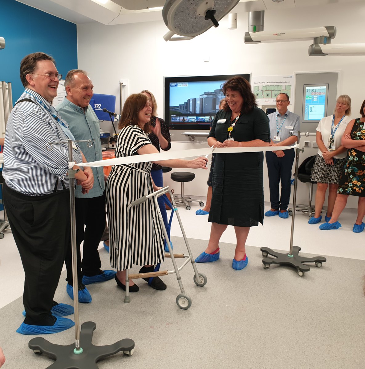 UHD_NHS's tweet photo. Cutting the ribbon in our new ‘barn’ theatre. 
Our new theatres are ‘fit for the future’ - designed to accommodate new technologies and techniques, and better environmental standards. #Pooletheatreopens https://t.co/JjR9A5HnyN