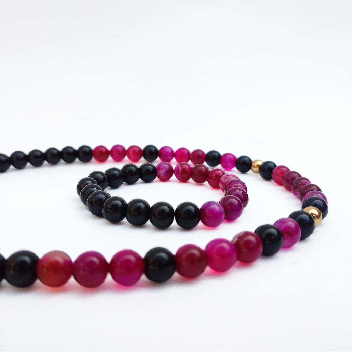 Men wear bright colours as well.
A magenta-colored necklace and bracelet set.

◾

#Marchian #personalizedjewelry #menstyle