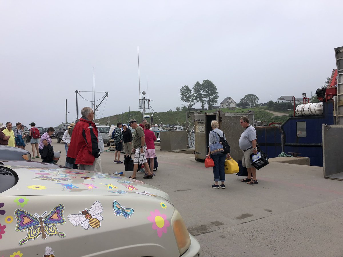 LucyNeatby's tweet photo. Quite a crowd waiting for the ferry this morning. The fog and damp is unsticking my paper piecing templates. It’s amazing what they can fit on this boat! #ferryride #tancookferry #englishpaperpiecing https://t.co/Ooy5XHg0b0