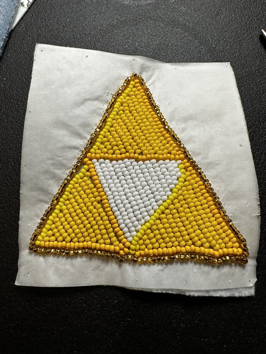 nerdyaunty92's tweet photo. Stayed up until 12:30 AM to finish this. Next step is to take the paper off. Turned out pretty good!
#NativeBeading #LegendofZelda #triforce #videogames https://t.co/D6cZgwkMfE