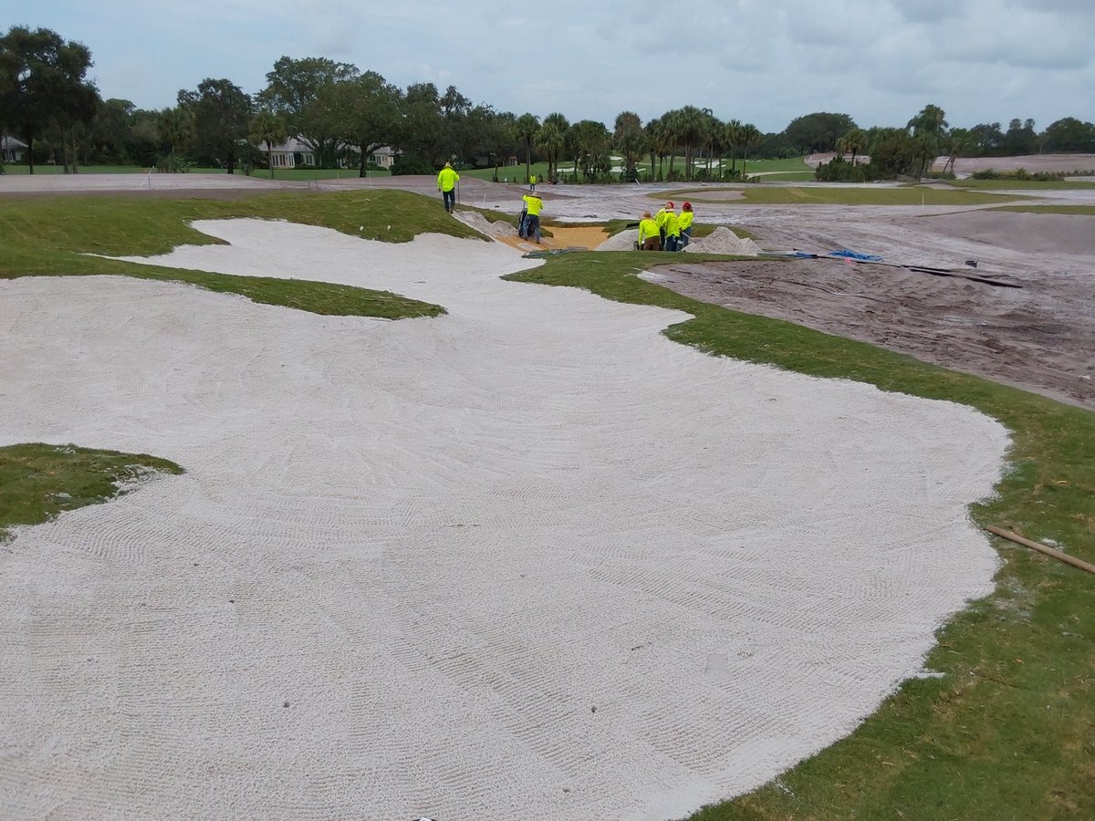 Filling the prepped bunkers at the Country Club of Florida, working alongside Architect Lester George with George Golf Design on this project.