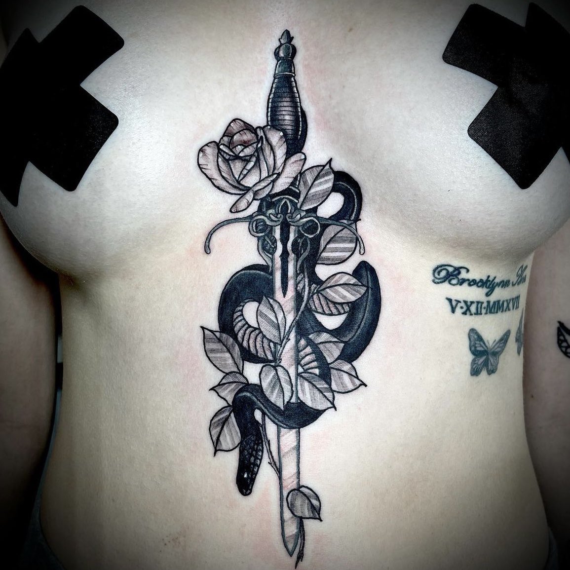 Throwback to this gorgeous sternum tattoo by our owner Cody! 🐍🖤🥀