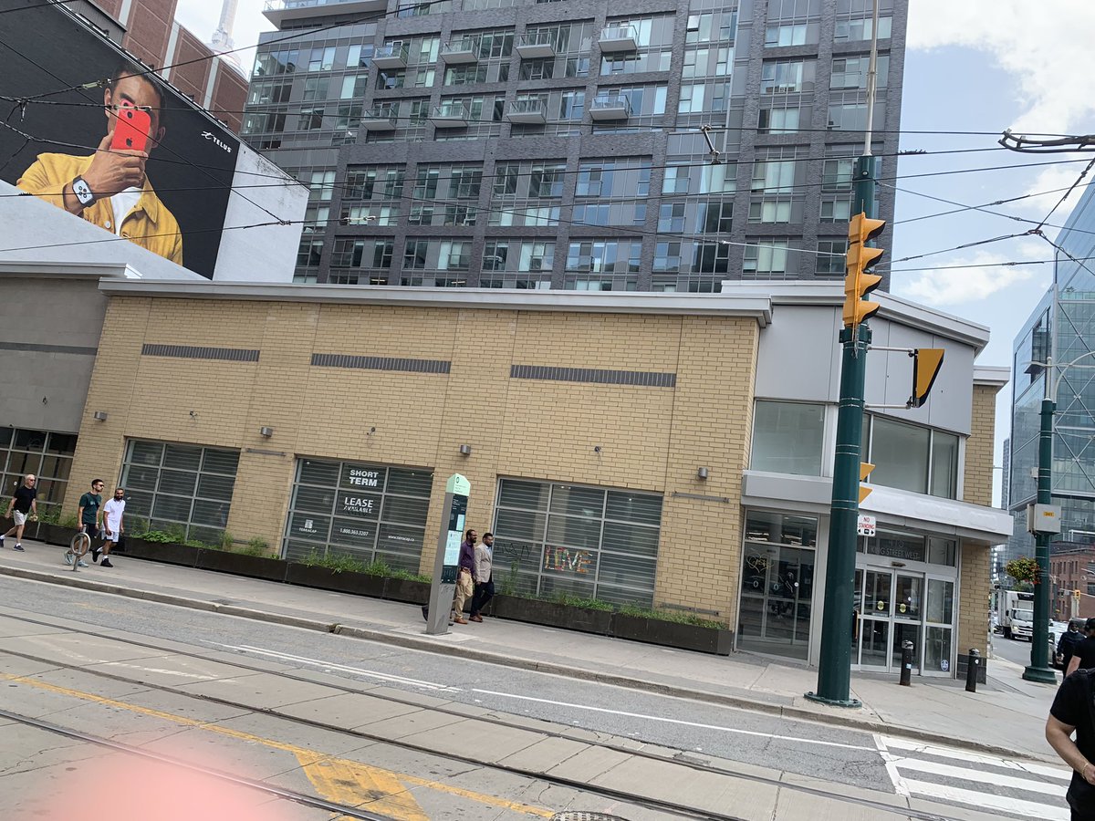 This building (Formerly an LCBO) is vacant and has been for a couple of years. When it was first proposed we begged the LCBO and the province to put temporary housing on top… now they could just put it inside around the corner from #129Peter #refugees