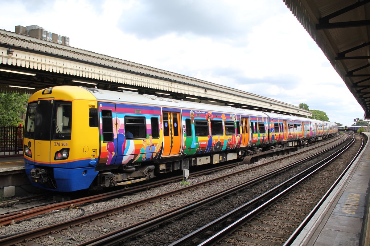 303032T's tweet image. Wearing an eyecatching overall wrap for Pride, a very colourful 378205  awaits departure from Clapham Junction with 2L21 10.23 service to  Stratford 12.7.23 @tfl #class378 #londonoverground #londonovergroundpride scottishtrains.zenfolio.com/p638436452/e72…