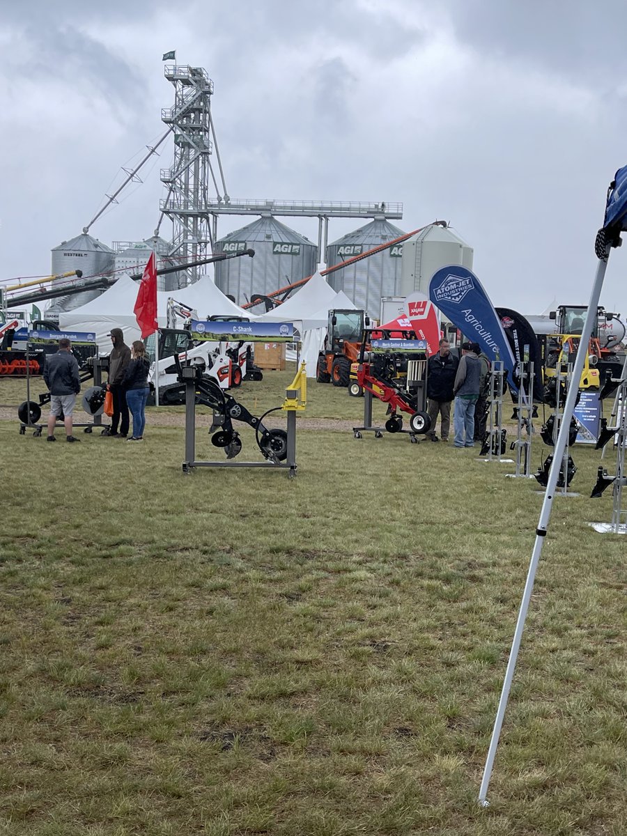 AtomJetAg's tweet photo. The weather may be cool and rainy at @AginMotion trade show, but nice to see our customers' enthusiasm for buying Atom-Jet openers #AIM #AtomJetAg https://t.co/mQ8IqPD9uT