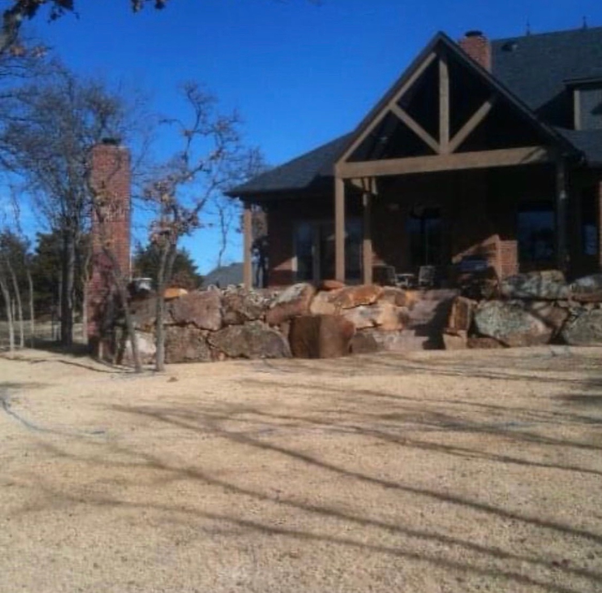 Swipe to see the “Before” in this backyard from an unusable outdoor space to multiple entertainment areas with a beautiful pool and water feature as a peaceful backdrop. #outdoorliving #homeimprovement #swimmingpools #renovations #familyfun #oklahomarealestate