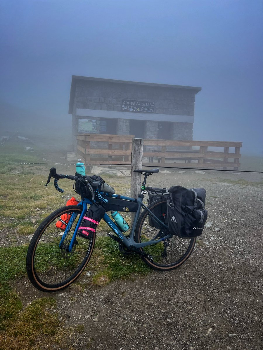 BellaCycling's tweet photo. Throwback to getting to the top of Col de Pailheres on our Pyrénées Traverse. Worst fog conditions I’ve experienced with a complete white out for the final 6kms. No real traffic bar some cows and sheep. Great climb. Still wonder what the views are like! #cycling #RaidPyrenees https://t.co/IyfPXl5jWr