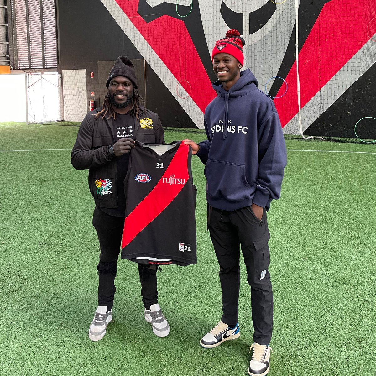 ParisStDenis's tweet photo. ⚽🏈Florian Grava, Hugo Muller, and Eneko Soto hanging out with Essendon Australian Rules Football legend @McTipungwuti43 during our trip to Australia this week. If @McTipungwuti43 wants to switch codes, we'll sign him up🙌

#ForThePeople #ParisStDenis #OneFutureFootball https://t.co/apyAywLBti