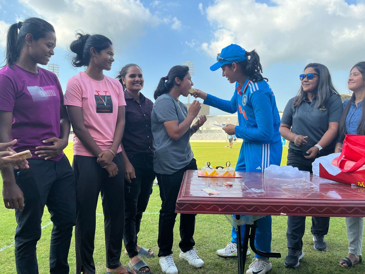 BCCIWomen's tweet photo. A sweet surprise 😊

Junior local cricketers in Dhaka brought a cake for @mandhana_smriti and celebrated her birthday after the 2nd ODI today. 🏏🎂🤝 #TeamIndia https://t.co/Rvfqqbop9h