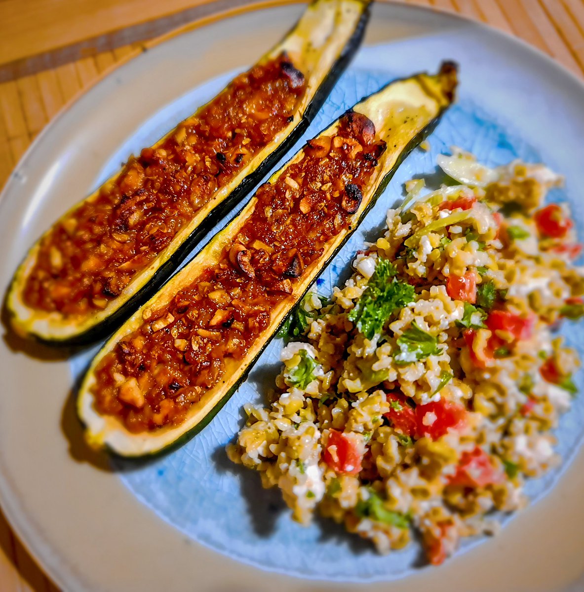 Not a bad experiment tonight. Roasted courgettes stuffed with honey and harissa spiced walnuts and cashews. Served with simple tabouleh. Yum