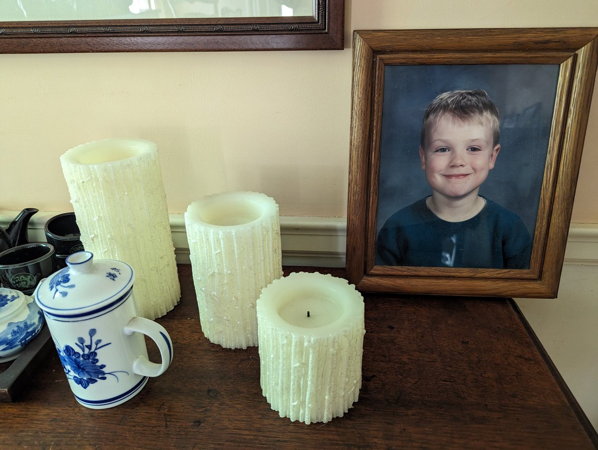 Confirm/deny that this arrangement at my parents' house makes it seem like I died in 1st grade: