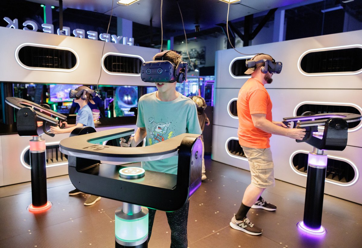 AndrettiKarting's tweet photo. Immerse yourself in whole new worlds in the 4-player Virtual Reality Experience of Hyperdeck! Feel wind, heat, and movement as you journey through an adventure unlike anything you've ever tried before. #andretti #Arcade #VirtualReality #VR #FamilyFun #SummerFun https://t.co/4zI8uz2uxN