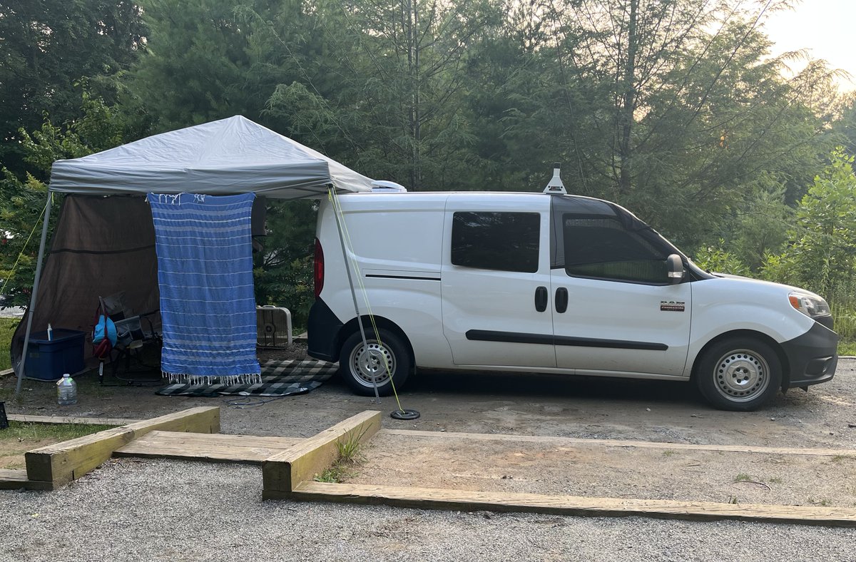 LeeColgin's tweet image. Camping in a van down by the river. A great place to get some writing done with the two best sidekicks around!