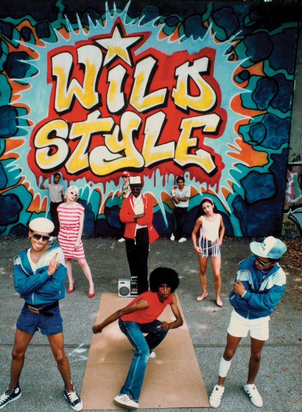 Throwback to 1983 in front of the 'Wild Style’ mural! The artwork on our special-edition library card celebrating 50 years of hip-hop is from the film’s soundtrack in the <a href="/SchomburgCenter/">SchomburgCenter</a> collections. 
Visit any NYPL branch &amp; get yours now! #HipHop50NYPL on.nypl.org/3O1ZWhl