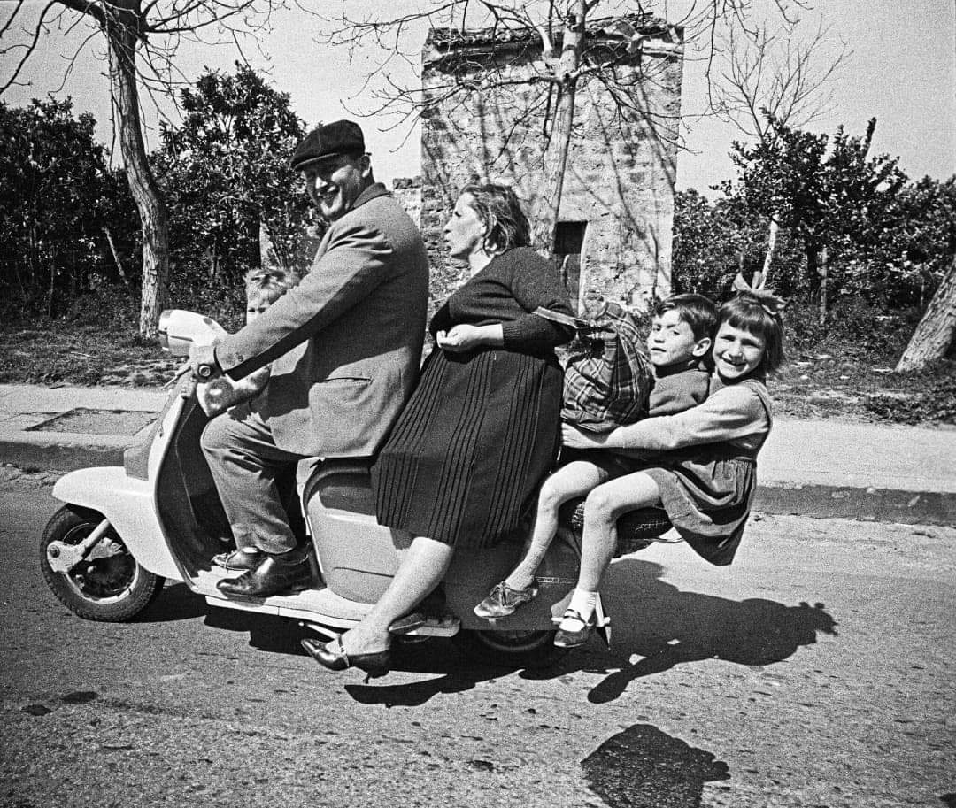 Italian family riding a Lambretta Scooter in Sicily, 1963.