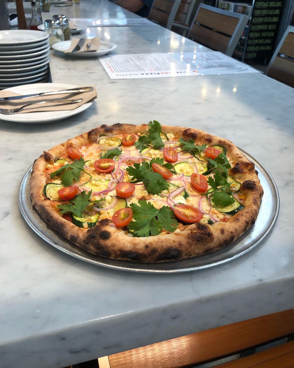 RP #LiveFirePizza 

Our summer pizza special is a taste of the season with fresh corn, cherry tomatoes, red onion, zucchini, goat and mozzarella cheese and cilantro $22 

@LiveFireOxbow #Napa 
#summerharvest #summervibes #woodovenpizza #oxbowpublicmarket #napavalley