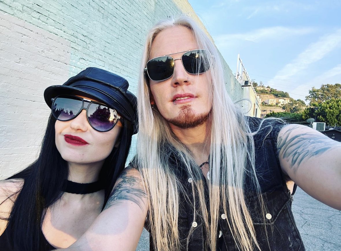 MarcHudson's tweet photo. Hey all, I hope everyone’s doing well! I’ve slept approximately 10 hours since coming back from LA and feel like a zombie 🧟♂️. Here’s a holiday snap of @aliciavigil and I when I was still a functioning human!
#starboundstories
#dragonforce
#vigilofwar
#jetlag https://t.co/omtWi3ElqM