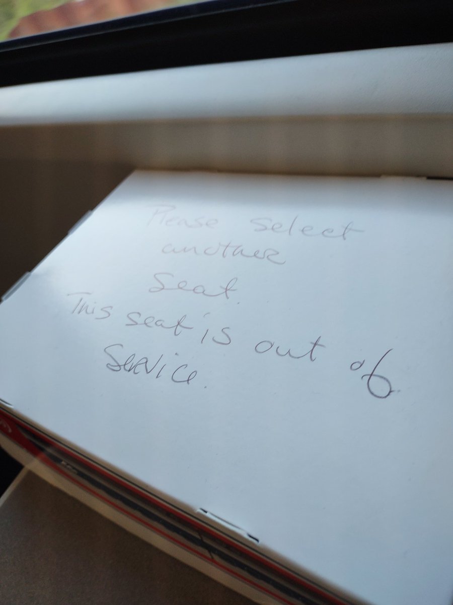 Val_bert's tweet photo. Lol nice try, kid.

Written on the back of a cardboard "tray" from the cafe car "Please select another seat. This seat is out of service" https://t.co/ajXK5jbcAT