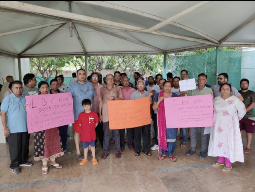 <a href="/tuscorian/">Thinking Cap</a> <a href="/savitreya9/">Anil Kumar Dube</a> <a href="/noidapolice/">POLICE COMMISSIONERATE GAUTAM BUDDH NAGAR</a> <a href="/noida_authority/">NOIDA Authority</a> <a href="/CeoNoida/">CEO, NOIDA Authority</a> <a href="/myogioffice/">Yogi Adityanath Office</a> <a href="/dr_maheshsharma/">Dr. Mahesh Sharma</a> <a href="/lbc_aoa/">LBC AOA</a> Residents protested against Manoj Prasad President AOA logix Blossom county sec 137 noida on 16th July against harassment, threatening in the name of CAM collection while society is in shambles and no transparency of accounts.