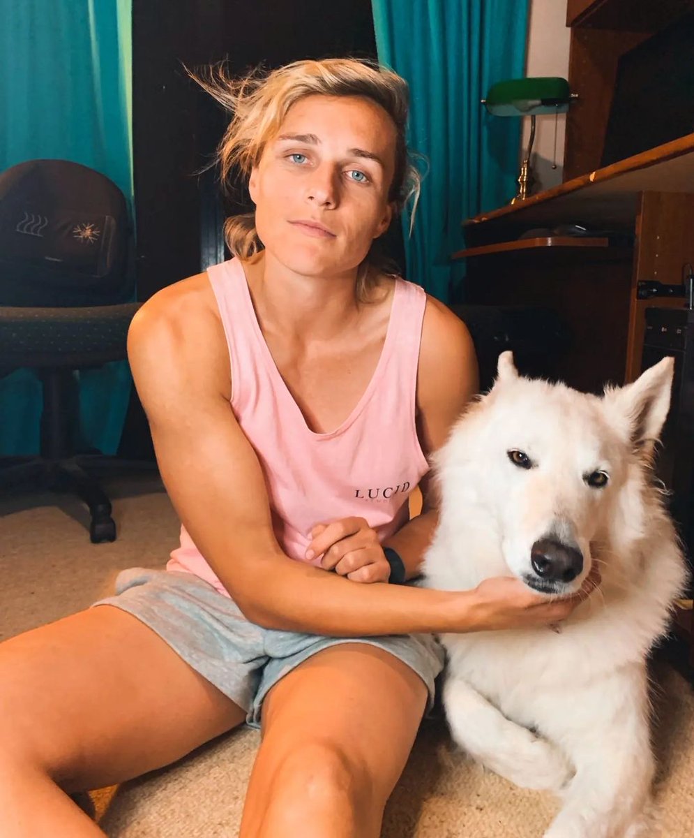 Hannah Wilkinson lightly tickling her dog #NZL