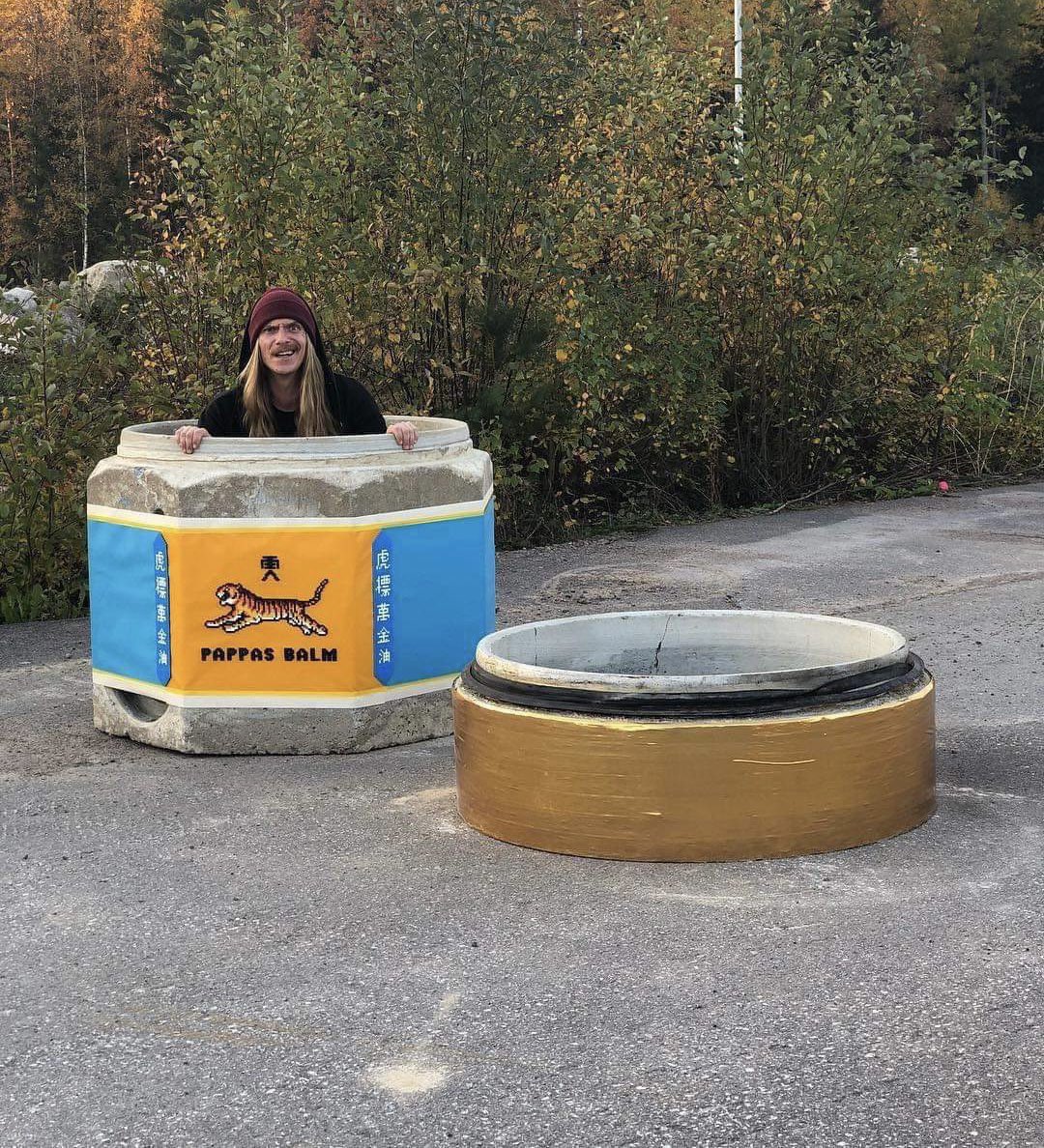 “Someone” painted the cement barriers into a giant Tiger Balm.