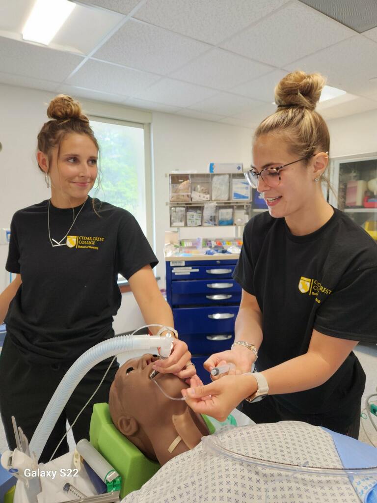 ccc_nursing's tweet photo. See one, do one, teach one - multiply that by hundreds! #CCCSON nurse anesthesia students participate in an airway workshop. Rising seniors help second-year students prepare to enter the clinical arena! #SRNA #CRNA #CedarCrestCollege #SummerinHBB https://t.co/sZpZr3wuhy
