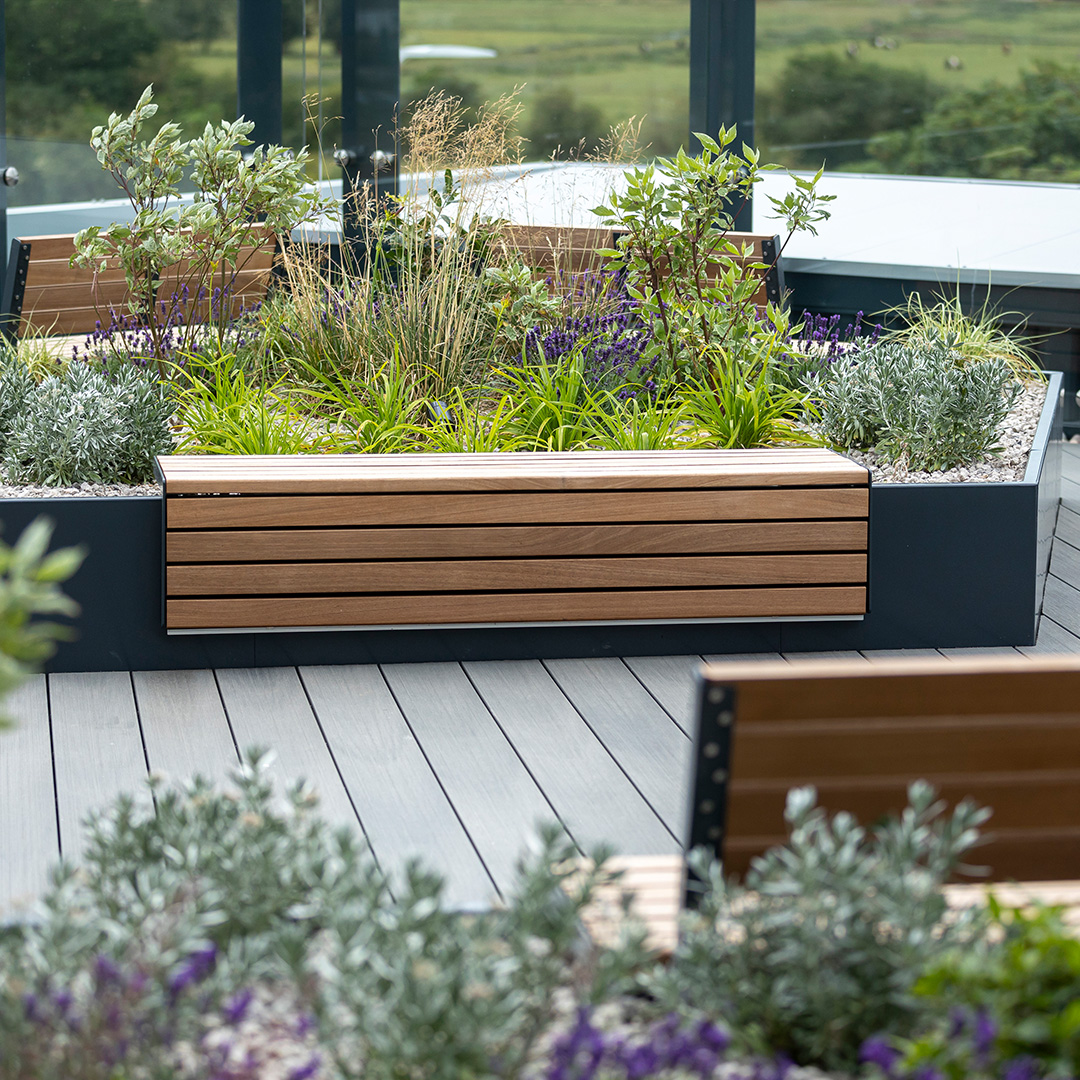FurnitubesUK's tweet photo. Proud to unveil our Rooftop Oasis at @prologisuk 🌱🌲Created using our AKRI #planters to bring life and tranquillity to the #roofterrace. Our #modular RailRoad #benches and Parallel #picnictables are also featured in the #outdoorspace below. https://t.co/spx05dLbG8