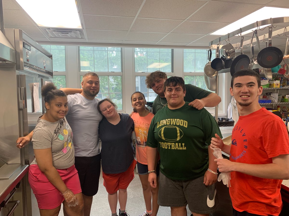 LongwoodCSD's tweet photo. In honor of National Hot Dog Day, held on Wednesday, July 29, leaders of the Longwood High School varsity football team worked with students to learn kitchen safety and to prepare and grill hot dogs! Yummy! #LCSDPride https://t.co/puiWJr4GH7