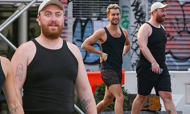 Josiah_FL's tweet photo. Sam Smith wears matching tank tops with rumoured boyfriend Christian Cowan for New York City stroll https://t.co/vCn7opojvt https://t.co/SCD0cDP6v6