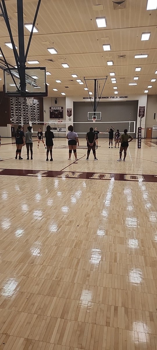 Volleyball and Coach Dentler hard at work