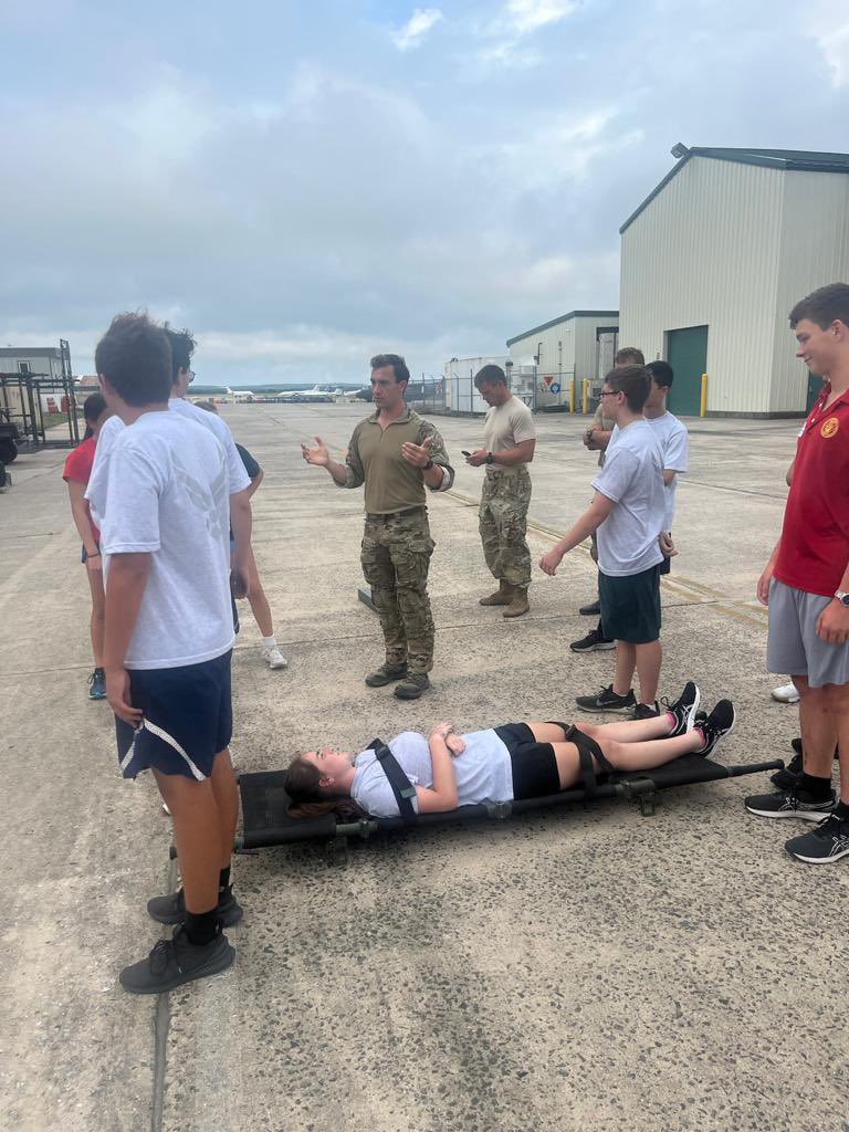 106th Rescue Wing’s first ROTC camp members being instructed on how to carry litters.