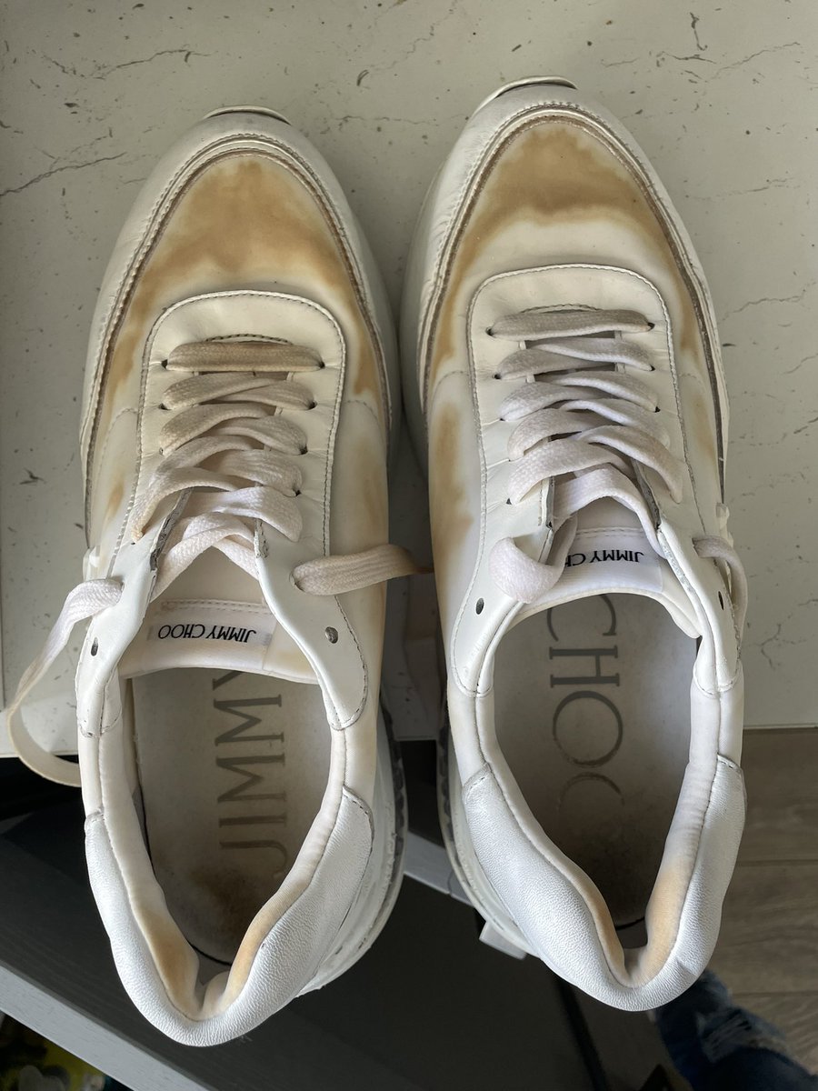 sibby1702's tweet photo. @jimmychoo drenched feet thanks to #greatbritishweather ☔️ and the orange lining / soles appear to have dyed my white trainers 🤔 help please! The marks won’t clean off! #jimmychoo #jimmychootrainers https://t.co/jQk1kdXLat