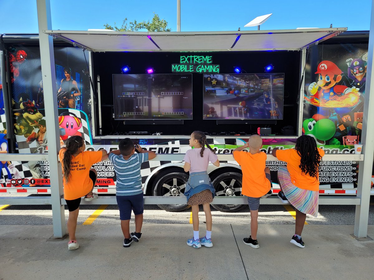Extended day summer camp enjoying the Gaming Bus on a hot summer day!