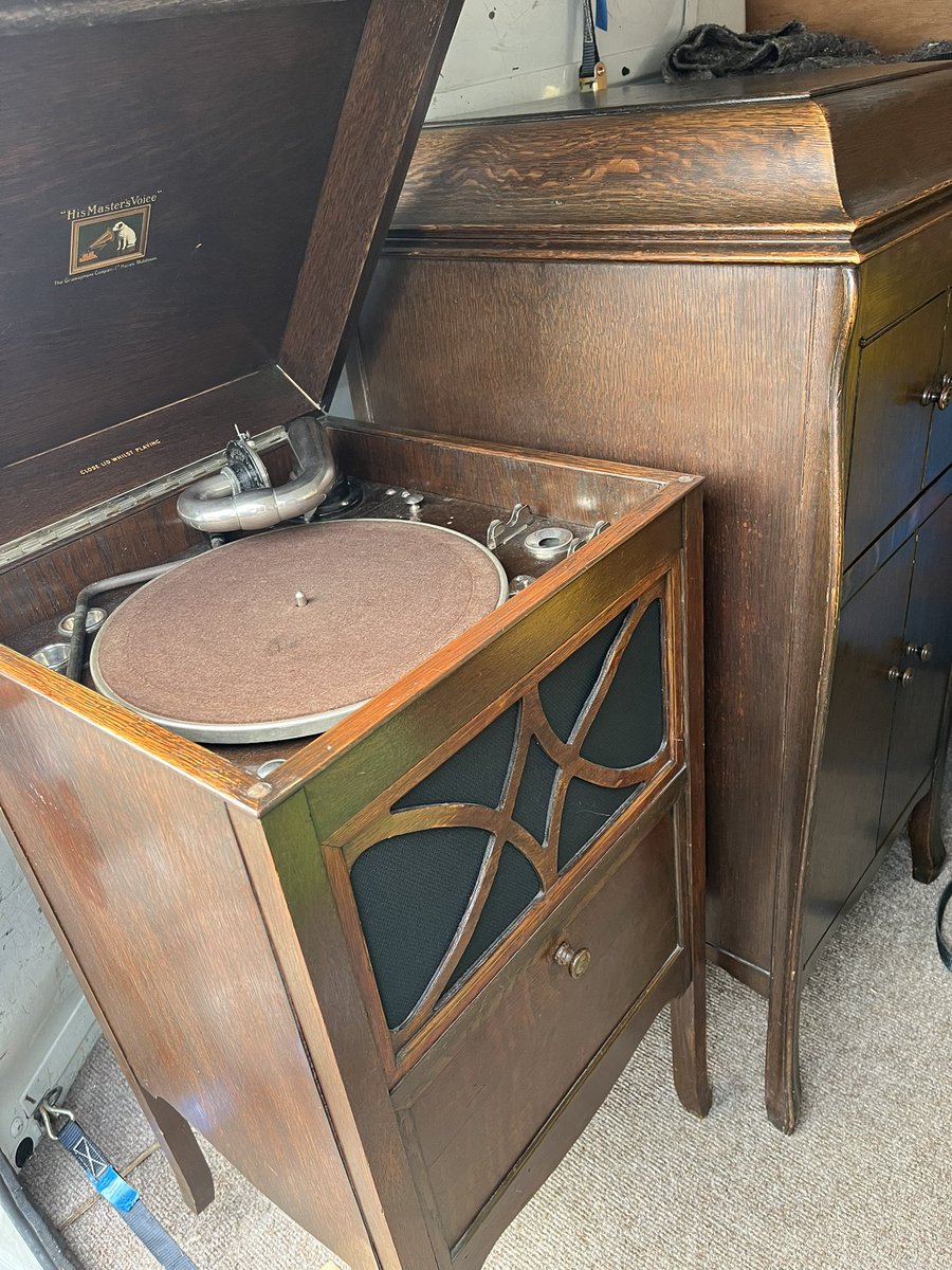 Another unusual consignment - a trio of gramophones being loaded for delivery to the Midlands