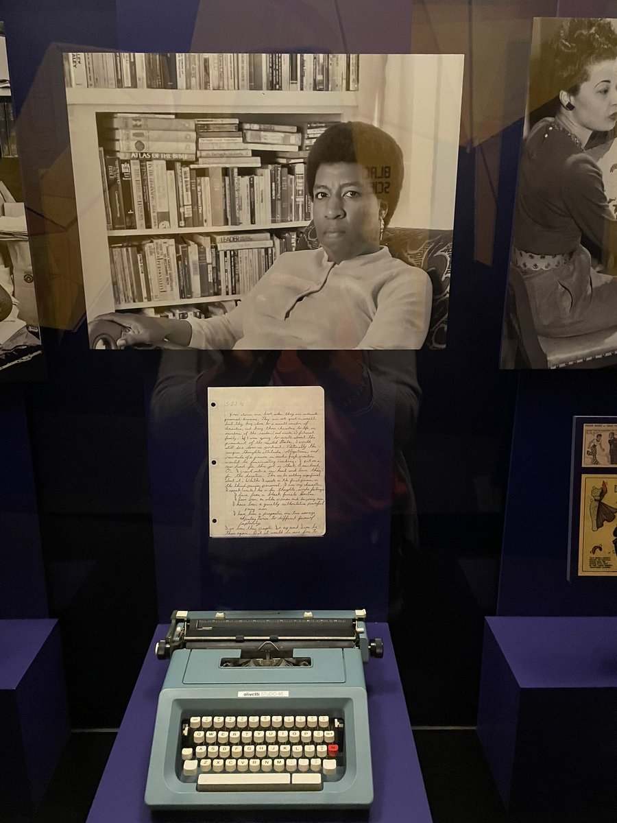KatColeReads's tweet photo. The Afrofuturism exhibit at @NMAAHC was incredible. If you are still in town for #IREL23 try to fit it in while in DC. Octavia Butler’s typewriter + handwritten note was ❤️. Already thinking about a display for our @NESlibrary using these postcards paired with some 🔥 books. https://t.co/j61O7lFZtX