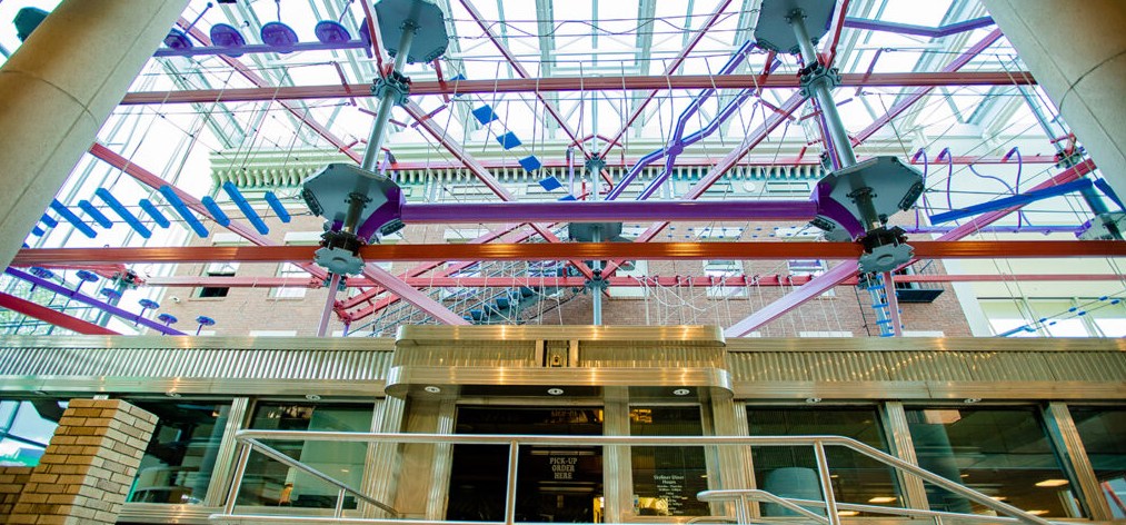 Jump into the realm of adventure play at The Strong Museum high ropes course—Skyline Climb. Suspended above the museum’s carousel atrium, adults and kids alike can traverse beams and balance obstacles, maneuver ropes and wobbly bridges, and leap off a zipline platform.